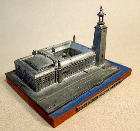 Stadhusett - Stockholm (City Hall - Stockholm), Sweden, height - 3”, Cast Metal.  Sticker on bottom reads, “Washfobik, Konsthantverk, Varby, Sweden.”  The City Hall was designed the National Romantic style by the architect Ragnar Ostberg and was completed in 1923. 