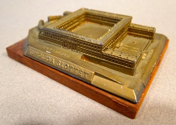 Kungliga Slottet - Stockholm (Royal Palace), Sweden, height - 1 1/8”, Cast Metal, Maker unknown.  Since completion 1974 it has served as the official royal residence of the Swedish Royal family.